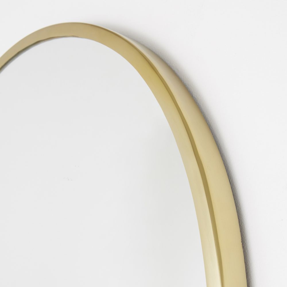 Miroir arche MENARA en métal doré, design raffiné à Dakar, Sénégal.